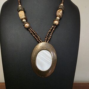 Elegant Bronze and Cream Pendant Necklace